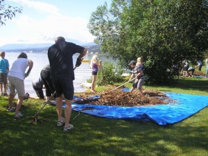 Young and old work together to get the beach ready for the summer. (2)